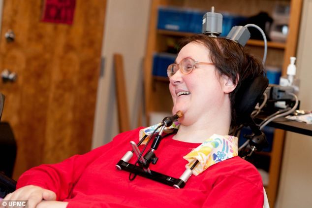 A paralyzed woman controls an artificial hand with the help of thought